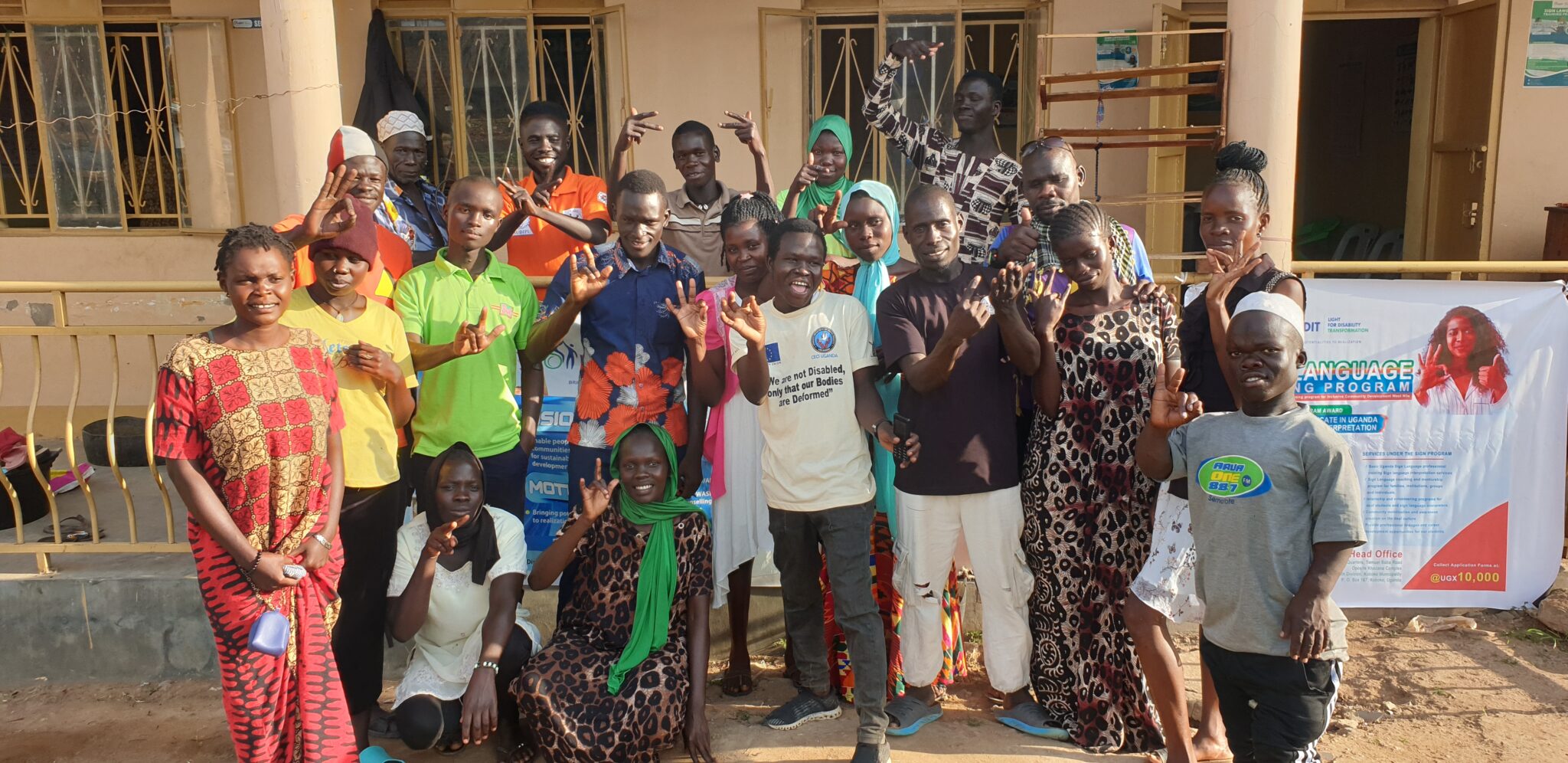 Deaf role models of Koboko Municipality taking photos after a meeting at LIDIT's Office