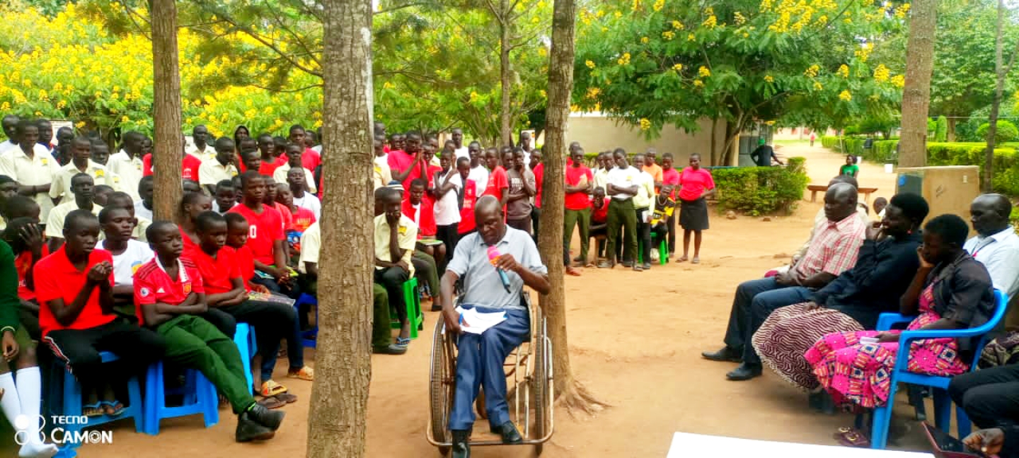 Mr. Gogo, BOD member and chairman Koboko Union of Disabled Persons Koboko addressing students during deaf awareness campaigns.